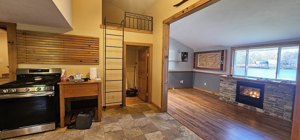 89 Jolicoeur Avenue, Unit 1 Spencer, MA 01562 - Photo 5 of 13 a view of a livingroom with furniture and a fireplace