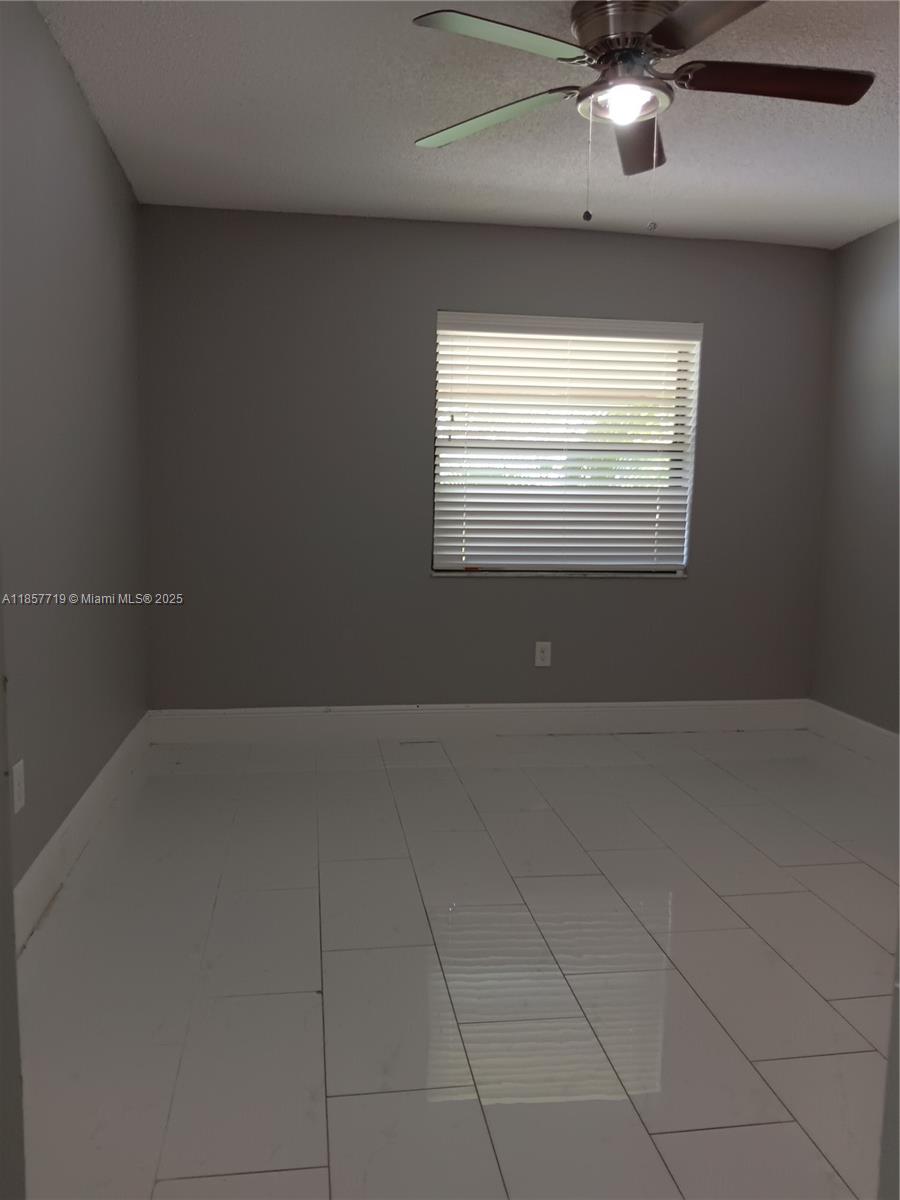 6040 Shaker Wood Circle, Unit 208 Tamarac, FL 33319 - Photo 12 of 25 a view of empty room with window