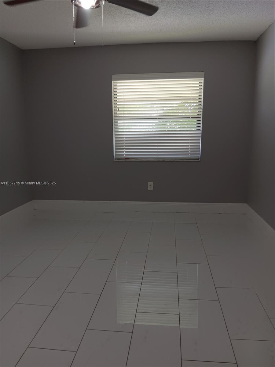 6040 Shaker Wood Circle, Unit 208 Tamarac, FL 33319 - Photo 13 of 25 a view of room and window
