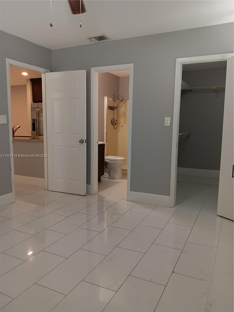 6040 Shaker Wood Circle, Unit 208 Tamarac, FL 33319 - Photo 14 of 25 a view of a hallway