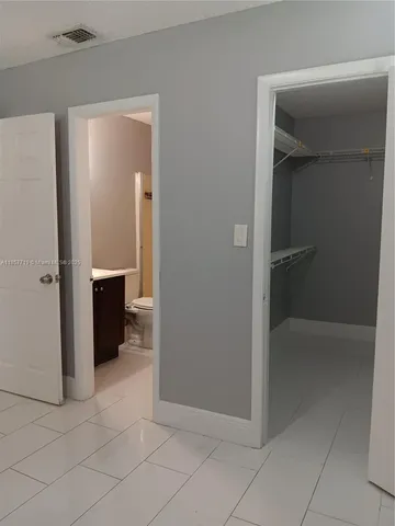 wooden floor and closet in a room