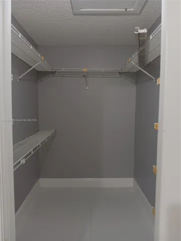 a empty closet with white paint