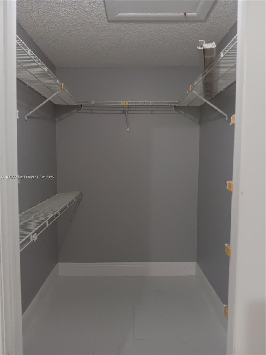 6040 Shaker Wood Circle, Unit 208 Tamarac, FL 33319 - Photo 16 of 25 a empty closet with white paint