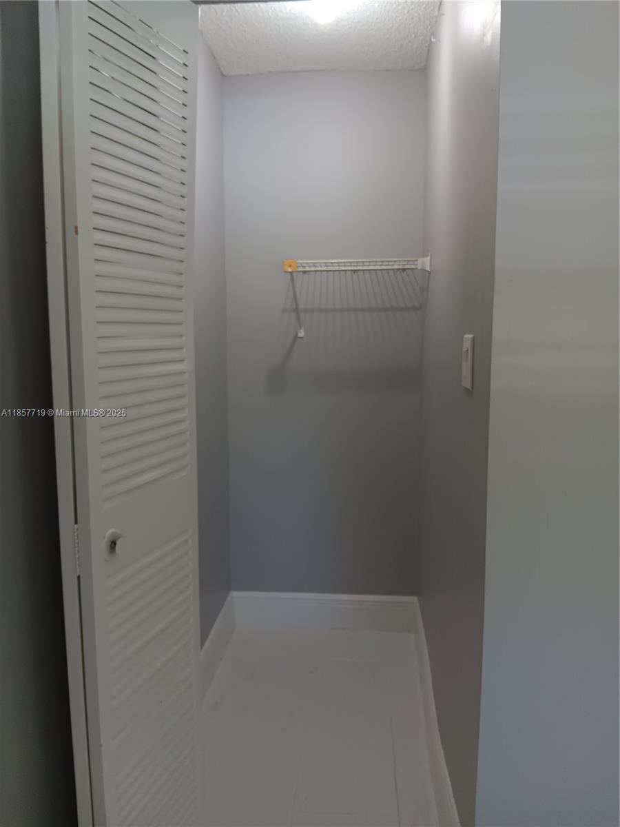 6040 Shaker Wood Circle, Unit 208 Tamarac, FL 33319 - Photo 21 of 25 a view of a room