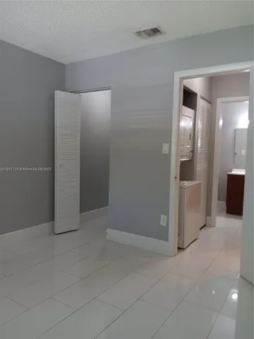 an empty room with a bathroom