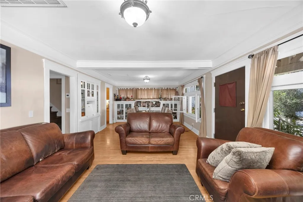 7612 Pickering Avenue Whittier, CA 90602 - Photo 11 of 53 a living room with furniture and a rug