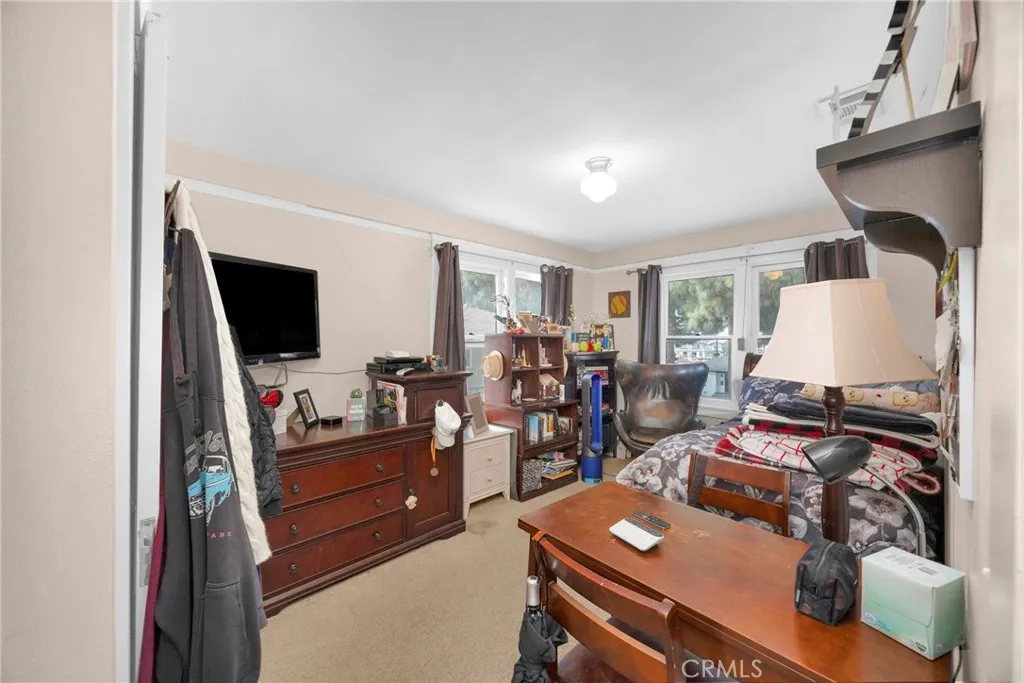 7612 Pickering Avenue Whittier, CA 90602 - Photo 25 of 53 a living room with furniture and a flat screen tv
