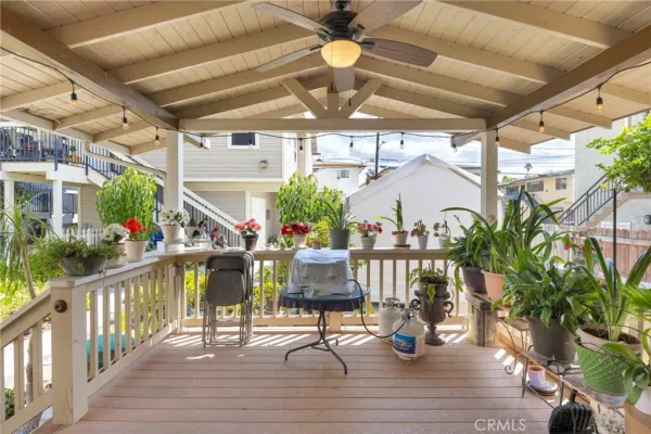 a view of a backyard with sitting area