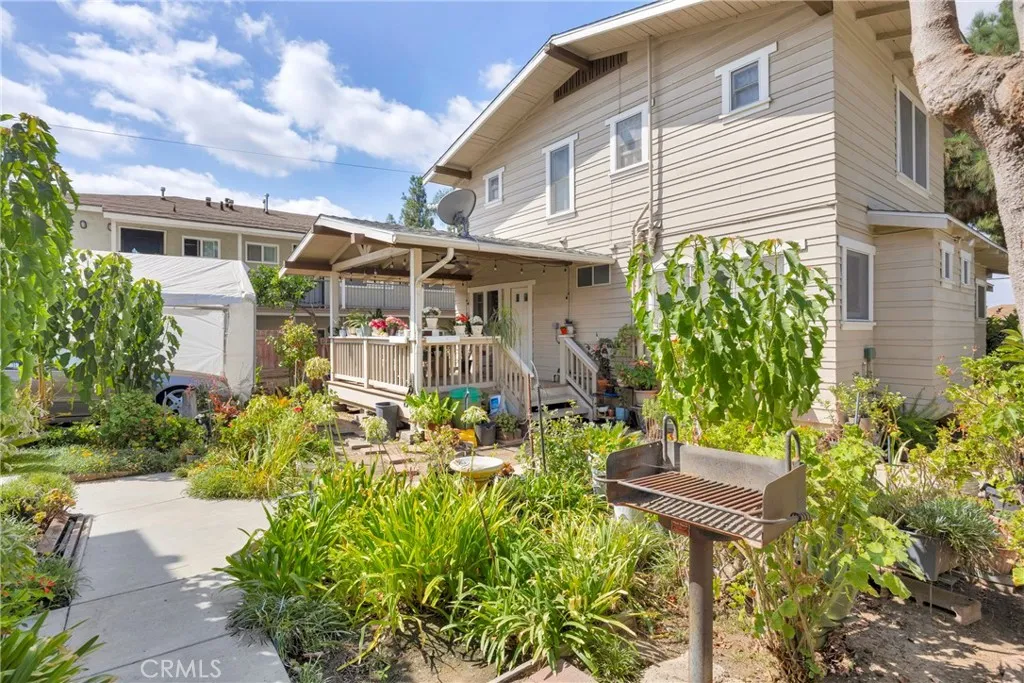 7612 Pickering Avenue Whittier, CA 90602 - Photo 27 of 53 a front view of a house with a garden