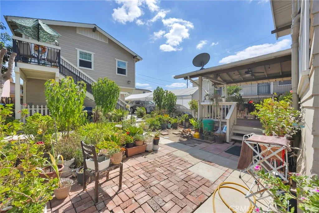 7612 Pickering Avenue Whittier, CA 90602 - Photo 28 of 53 a view of a patio with table and chairs and potted plants