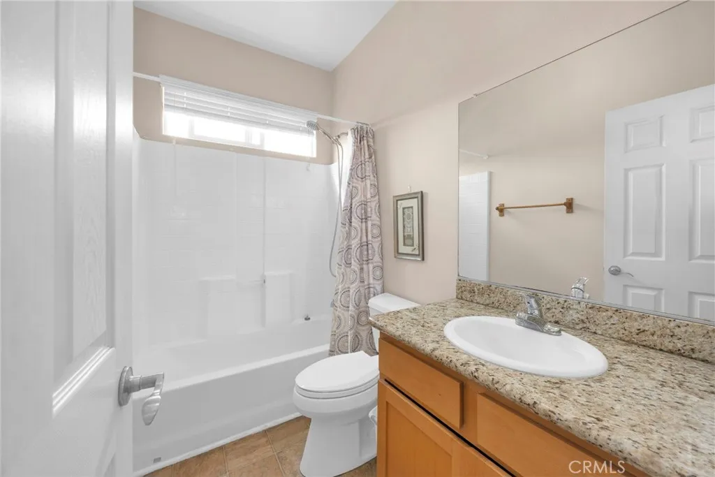 7612 Pickering Avenue Whittier, CA 90602 - Photo 41 of 53 a bathroom with a granite countertop sink toilet and shower