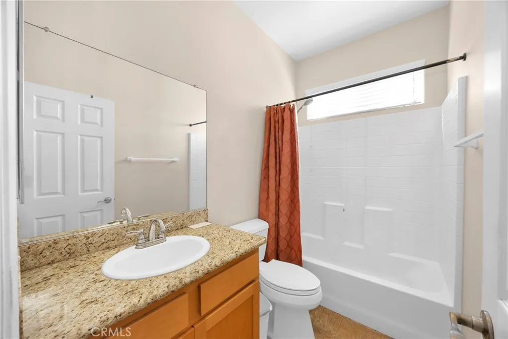 7612 Pickering Avenue Whittier, CA 90602 - Photo 45 of 53 a bathroom with a sink and a mirror