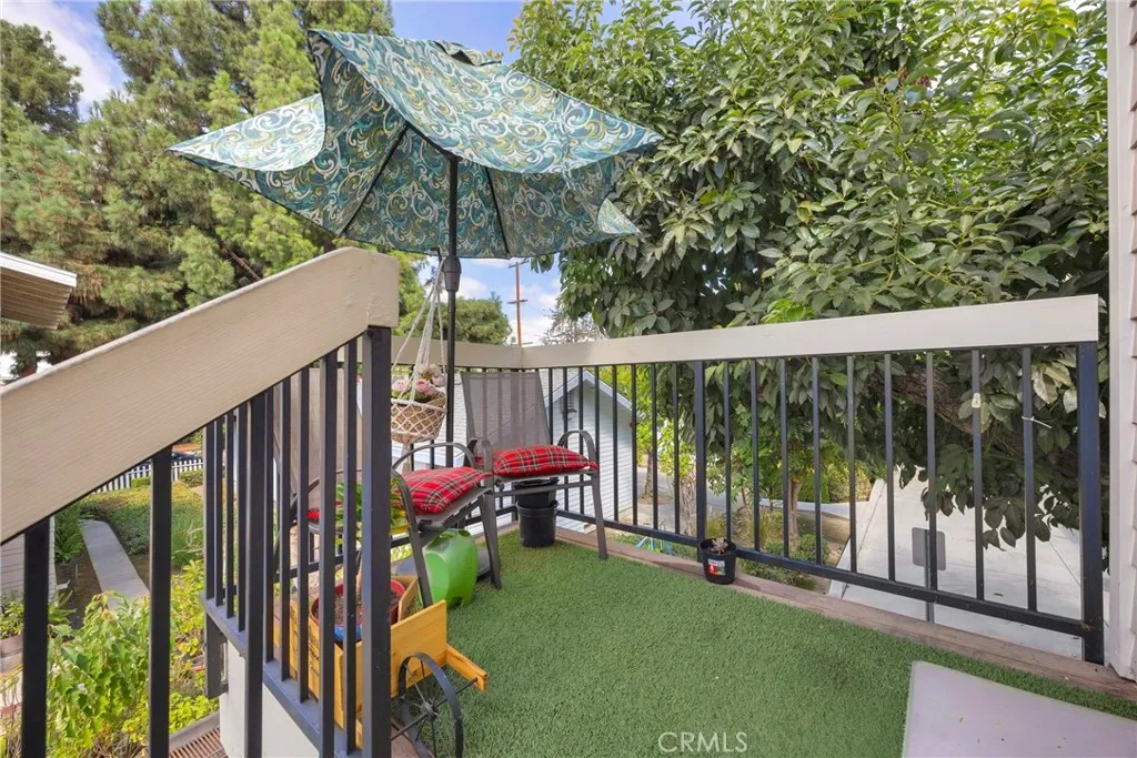 7612 Pickering Avenue Whittier, CA 90602 - Photo 48 of 53 a view of a deck with a table and chairs next to a yard