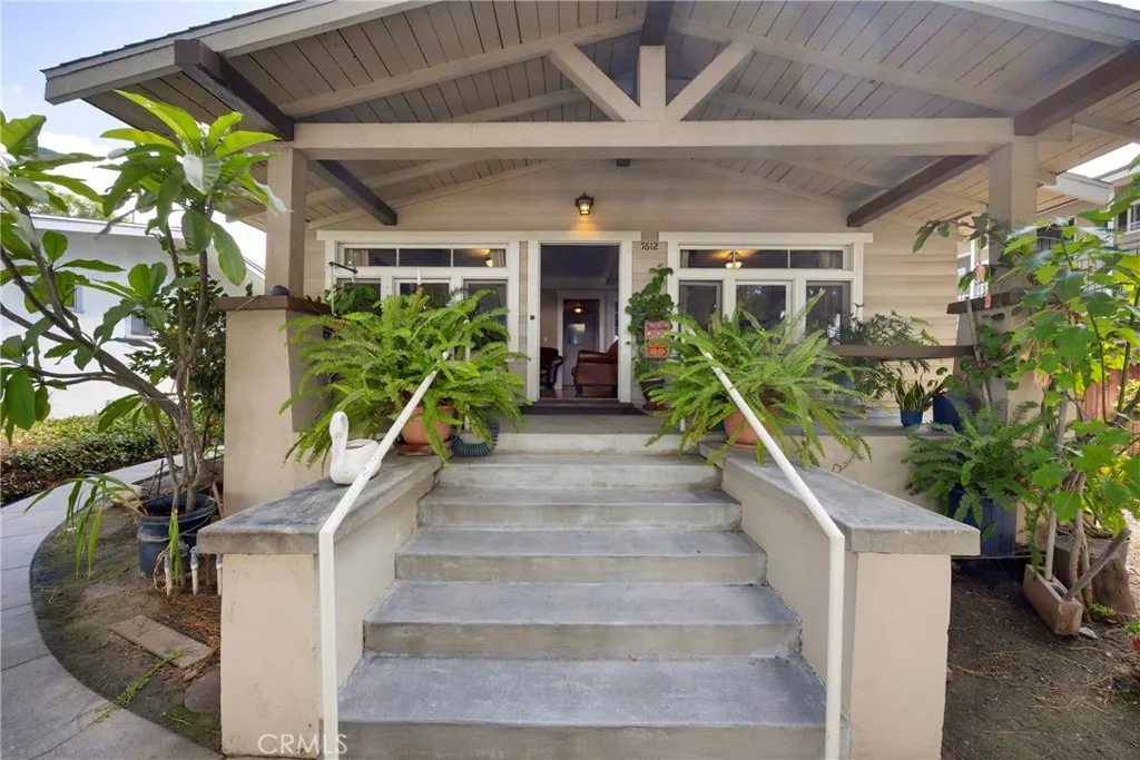 7612 Pickering Avenue Whittier, CA 90602 - Photo 6 of 53 a front view of a house with a porch