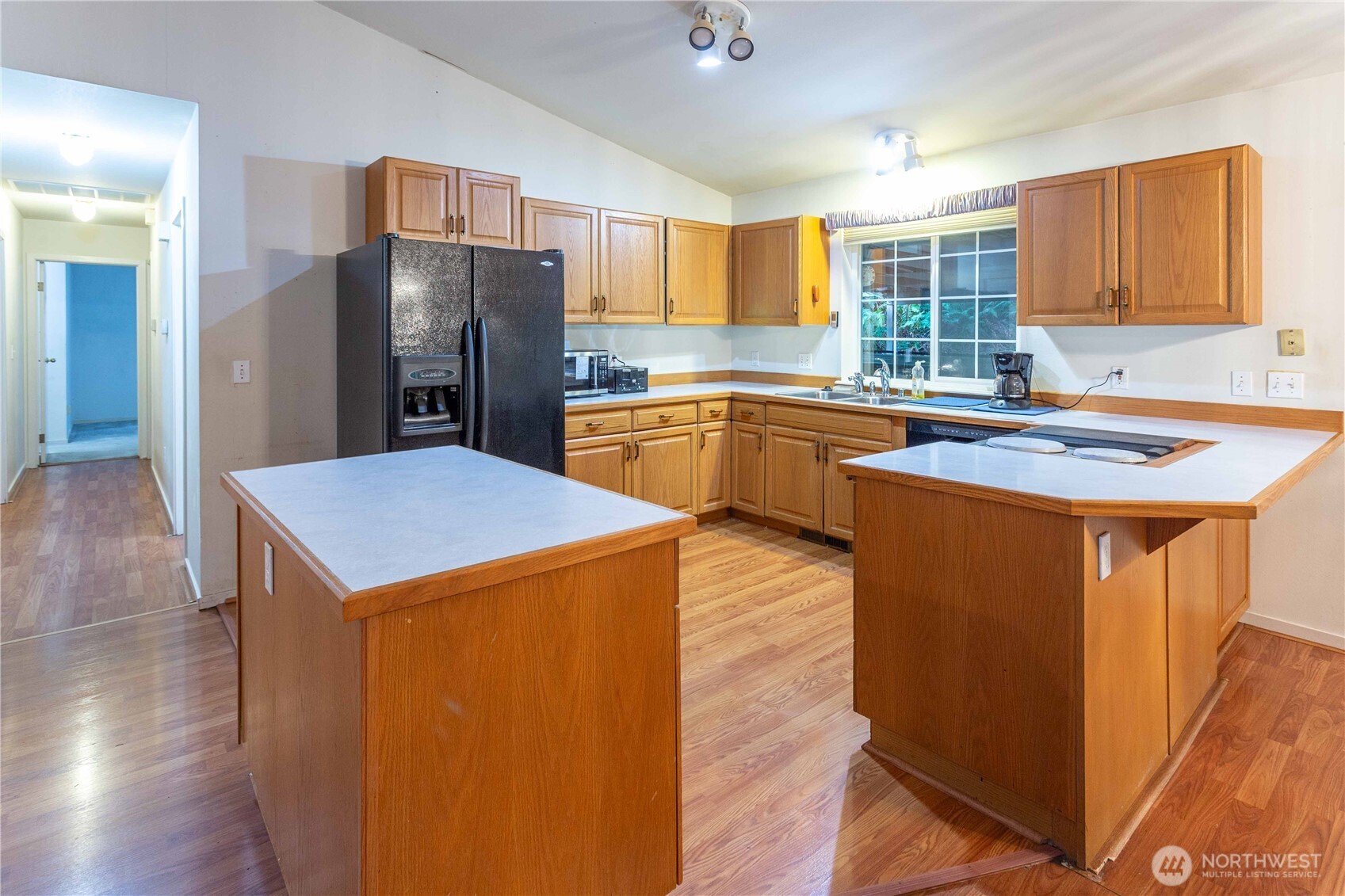 396 Sudden Valley Drive Bellingham, WA 98229 - Photo 13 of 28 a kitchen with stainless steel appliances granite countertop a sink stove and refrigerator
