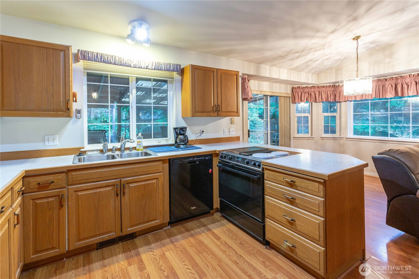 396 Sudden Valley Drive Bellingham, WA 98229 - Photo 10 of 28 a kitchen with stainless steel appliances granite countertop a stove and a sink