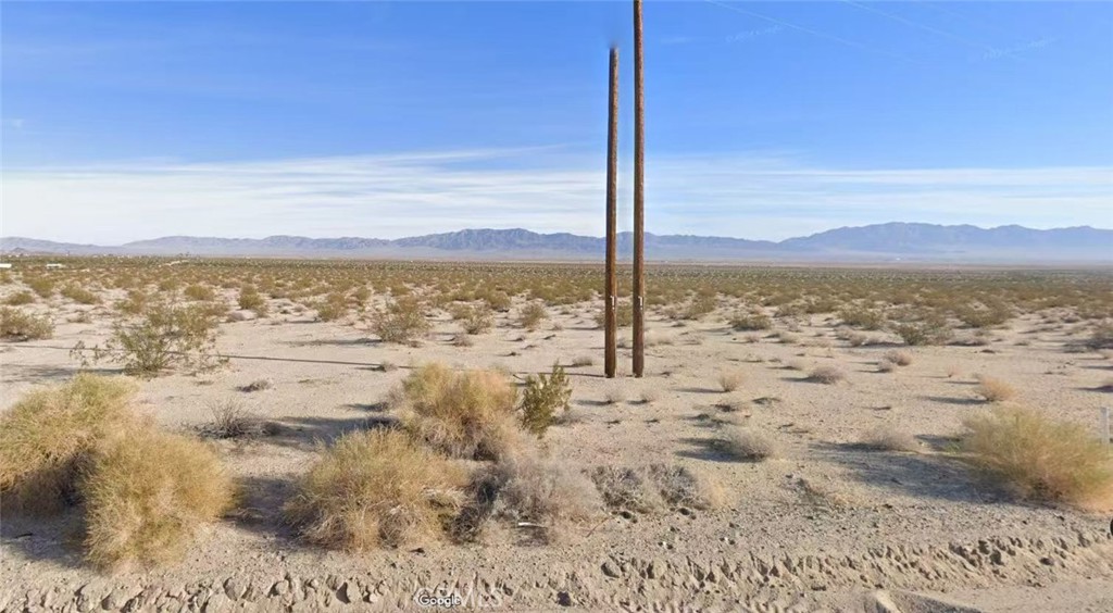 a view of ocean with a mountain