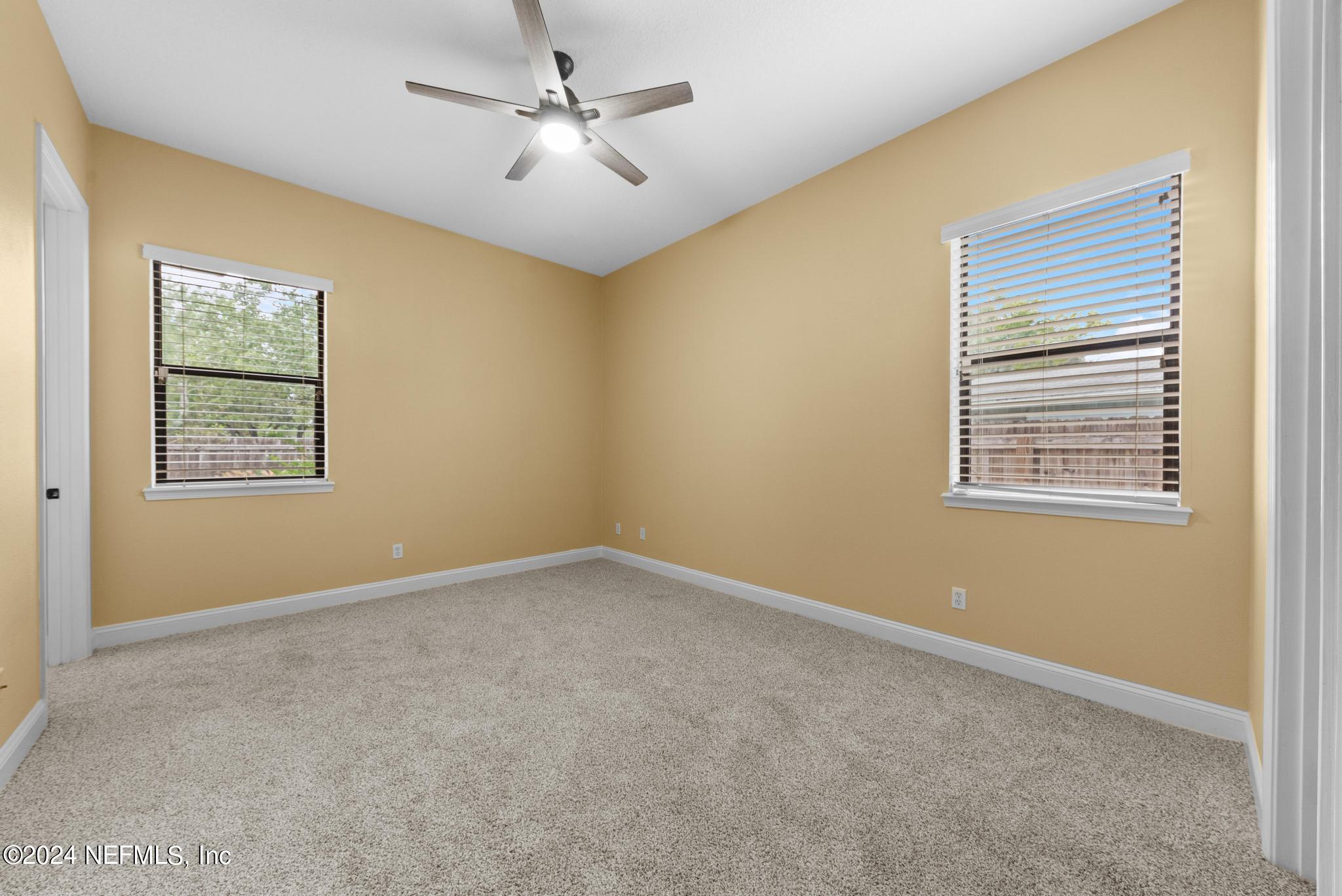 218 Lily Road St. Augustine, FL 32086 - Photo 17 of 28 a view of an empty room with a window
