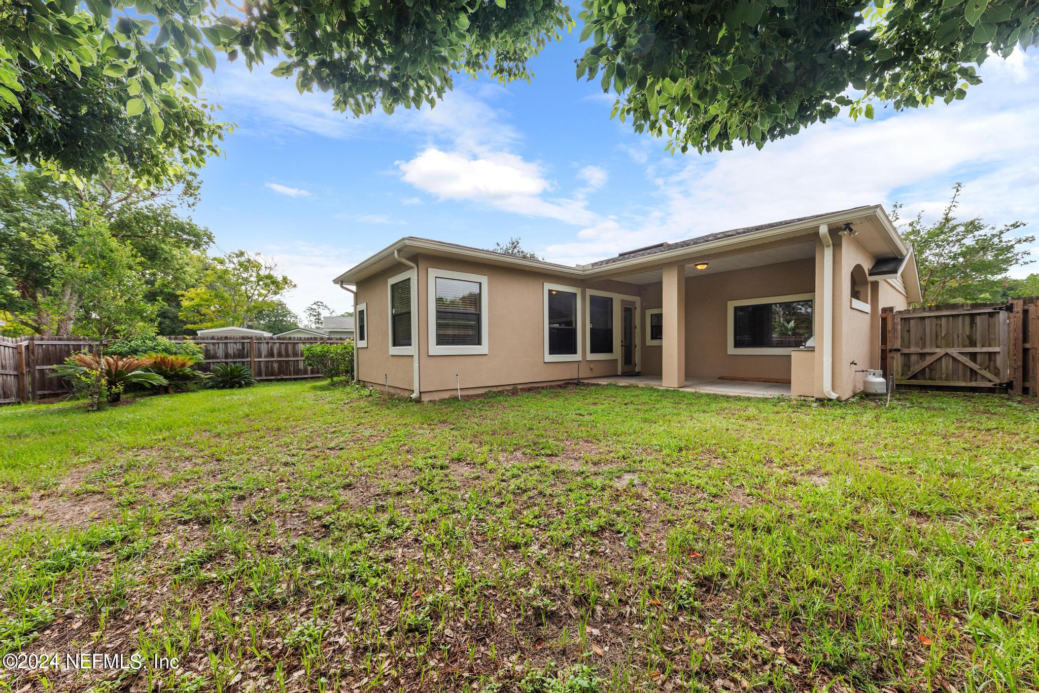 218 Lily Road St. Augustine, FL 32086 - Photo 28 of 28 a view of a house with backyard