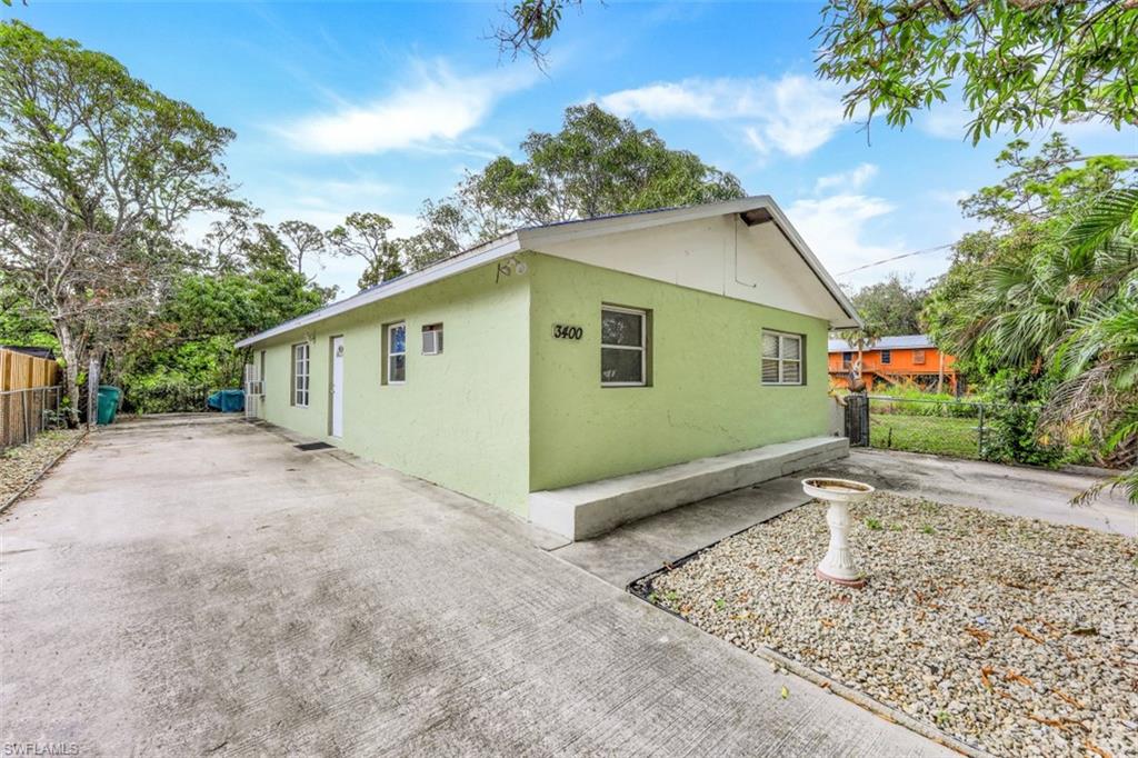 3400 Canal Street Naples, FL 34112 - Photo 15 of 32 a backyard of a house with lots of green space