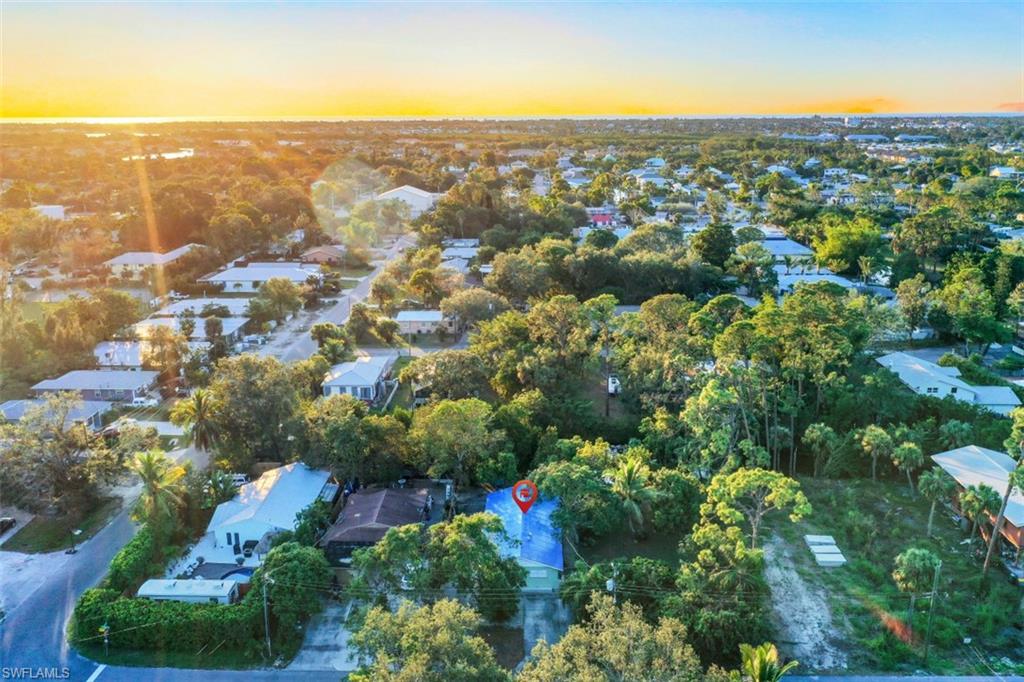 3400 Canal Street Naples, FL 34112 - Photo 18 of 32 an aerial view of residential building with green space