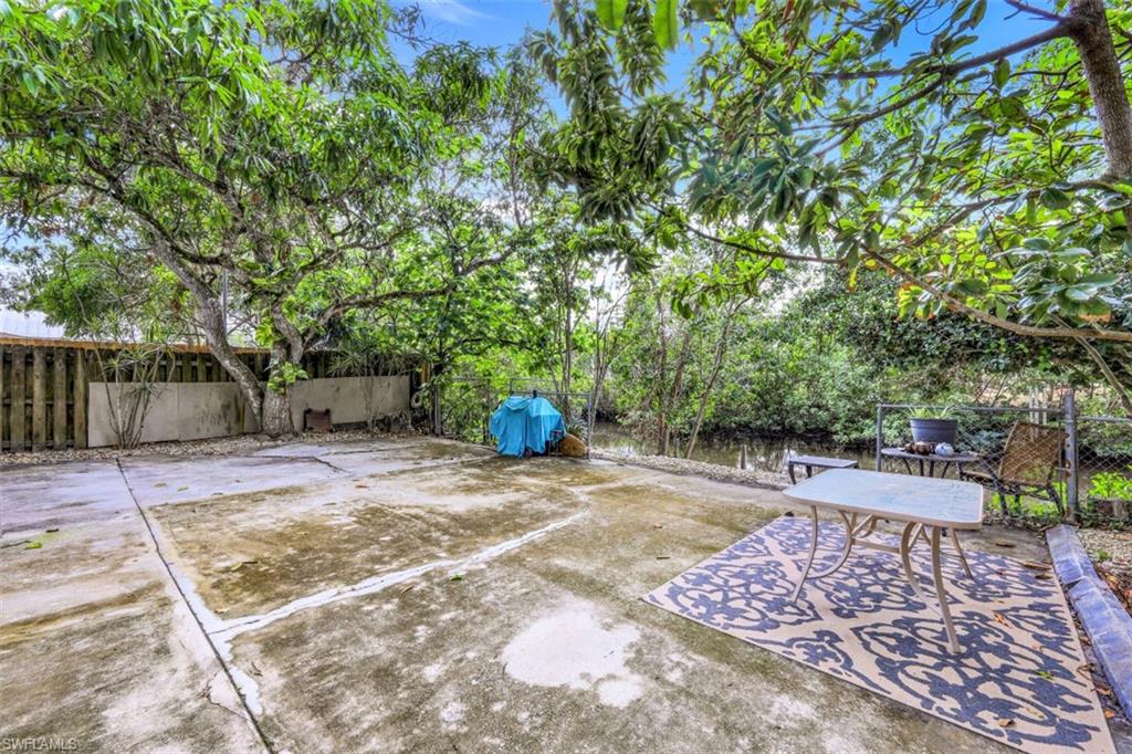 3400 Canal Street Naples, FL 34112 - Photo 23 of 32 a view of a backyard with large trees