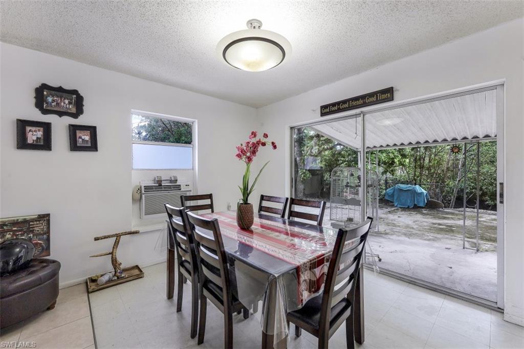 3400 Canal Street Naples, FL 34112 - Photo 3 of 32 a view of a dining room with furniture window and outside view