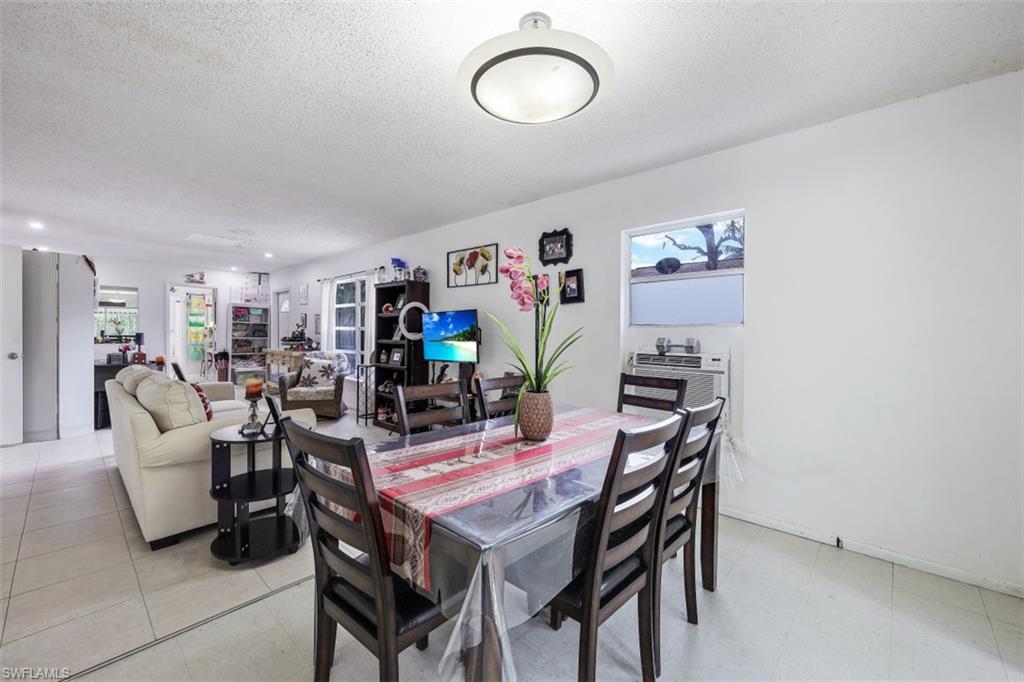 3400 Canal Street Naples, FL 34112 - Photo 4 of 32 a view of a dining room with furniture