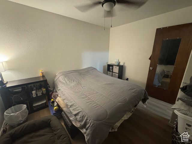 527 Palisade Drive Moab, UT 84532 - Photo 12 of 51 Bedroom featuring LVP finished floors and ceiling fan
