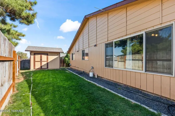 a view of backyard with hardwood and deck