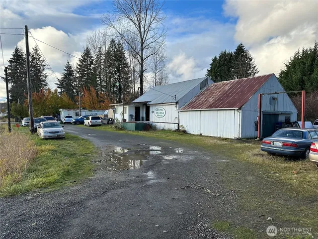 a view of a house with truck parked in front of a house