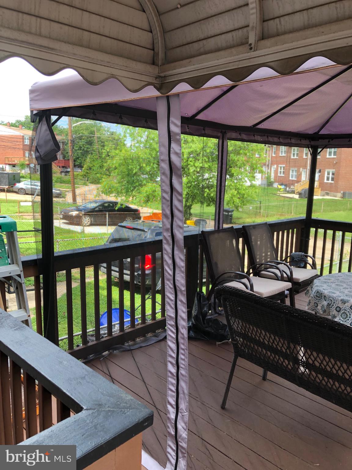 4383 Crest Heights Road Baltimore, MD 21215 - Photo 11 of 34 Off Kitchen Wooden Deck With Screen Covering