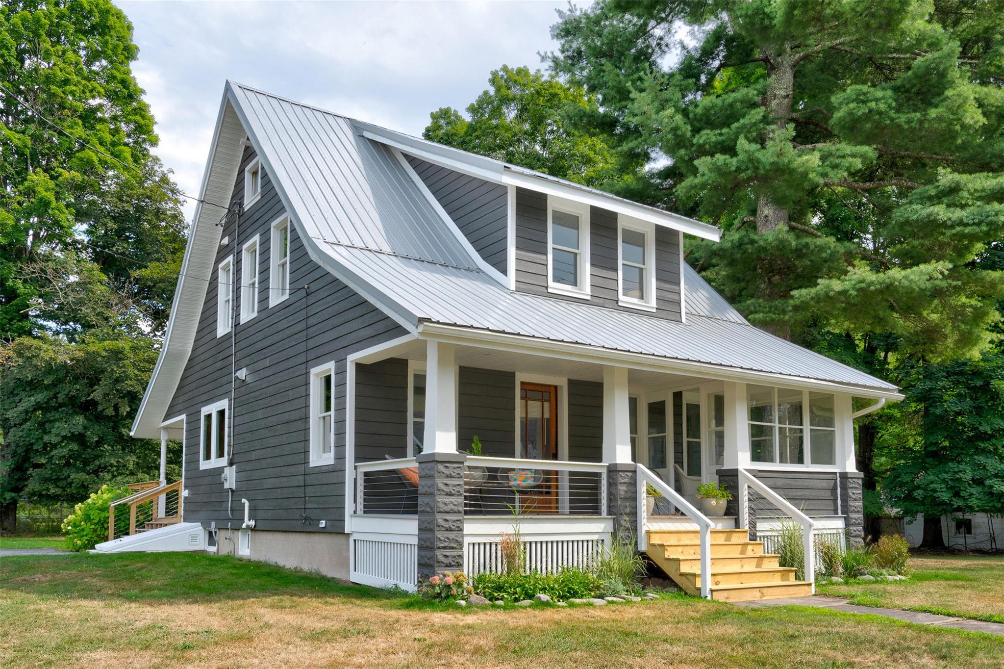 a front view of a house with a yard