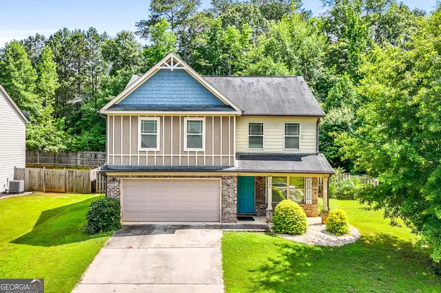 a front view of a house with garden