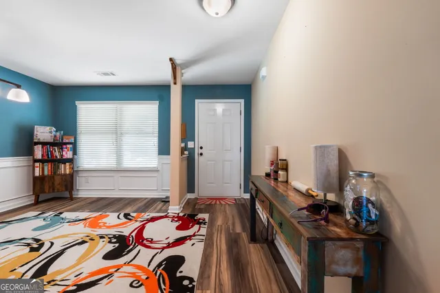 a bedroom with bed and a window