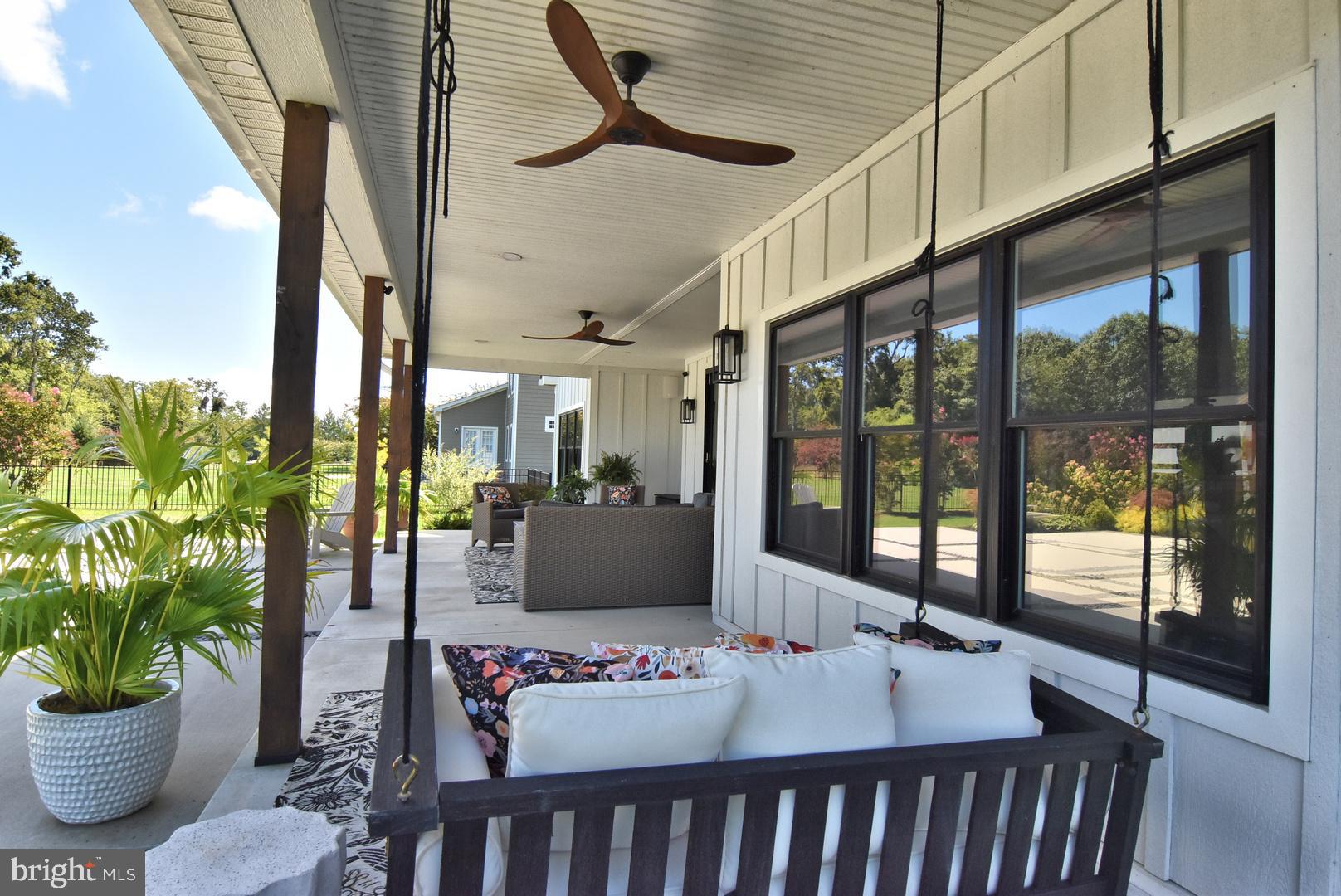 30921 Stallion Lane Lewes, DE 19958 - Photo 19 of 65 a living room with furniture and a potted plant