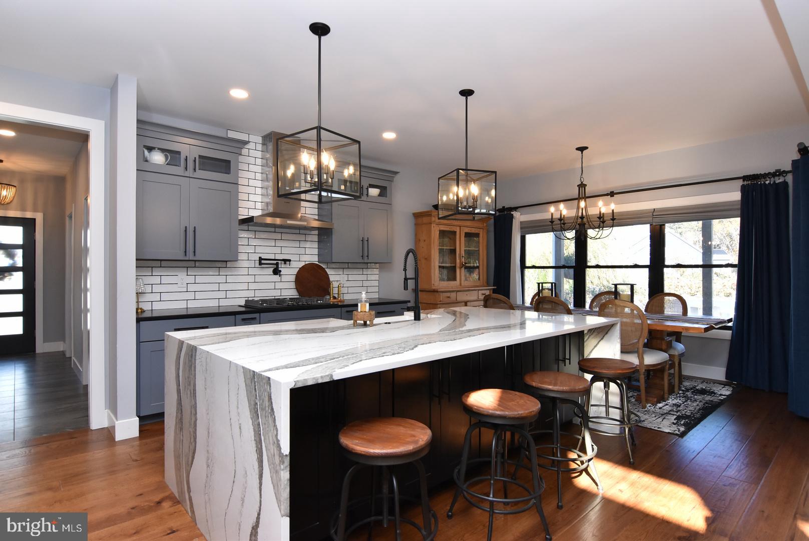 30921 Stallion Lane Lewes, DE 19958 - Photo 25 of 65 a kitchen with center island and wooden floor