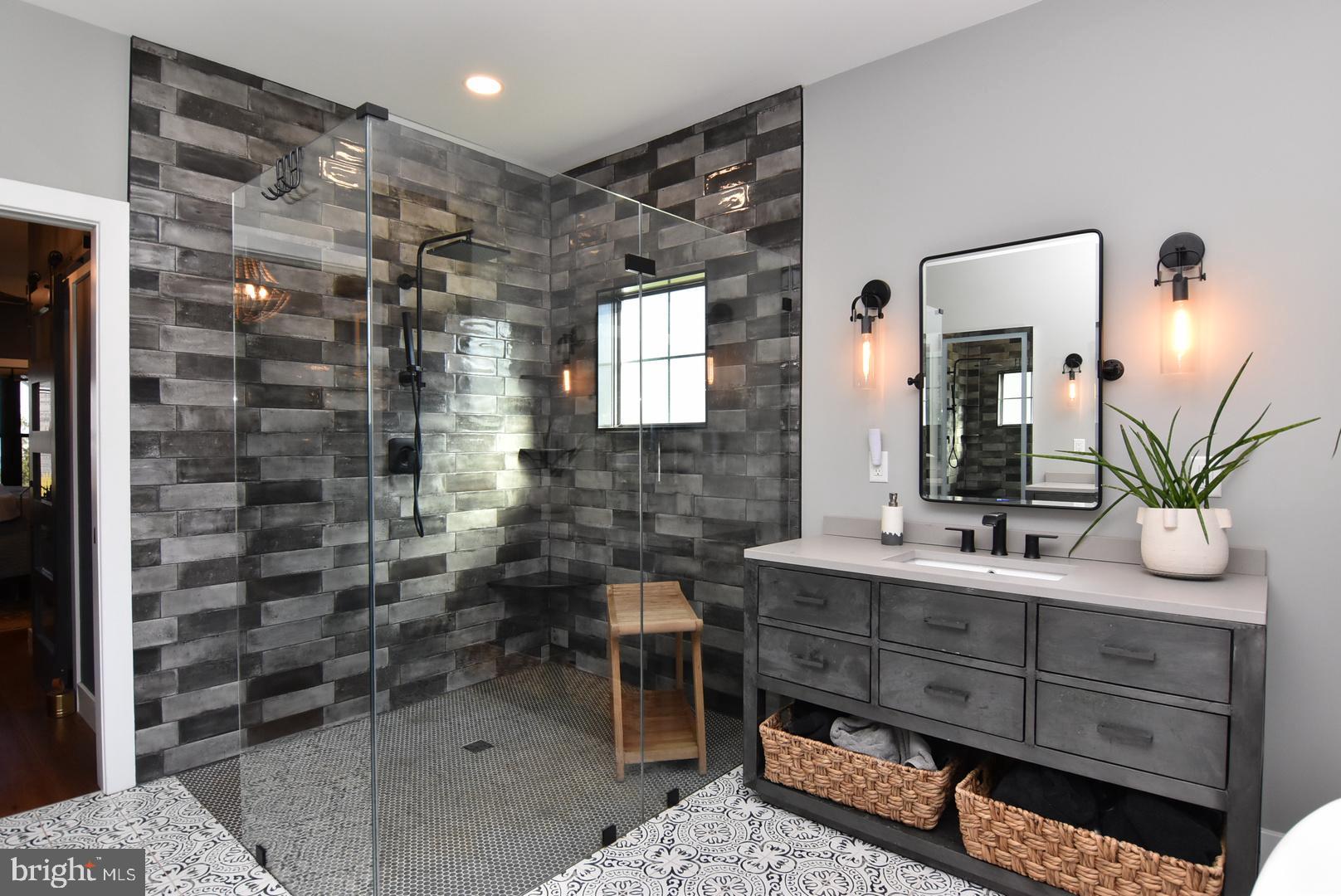 30921 Stallion Lane Lewes, DE 19958 - Photo 36 of 65 a bathroom with a sink and a mirror