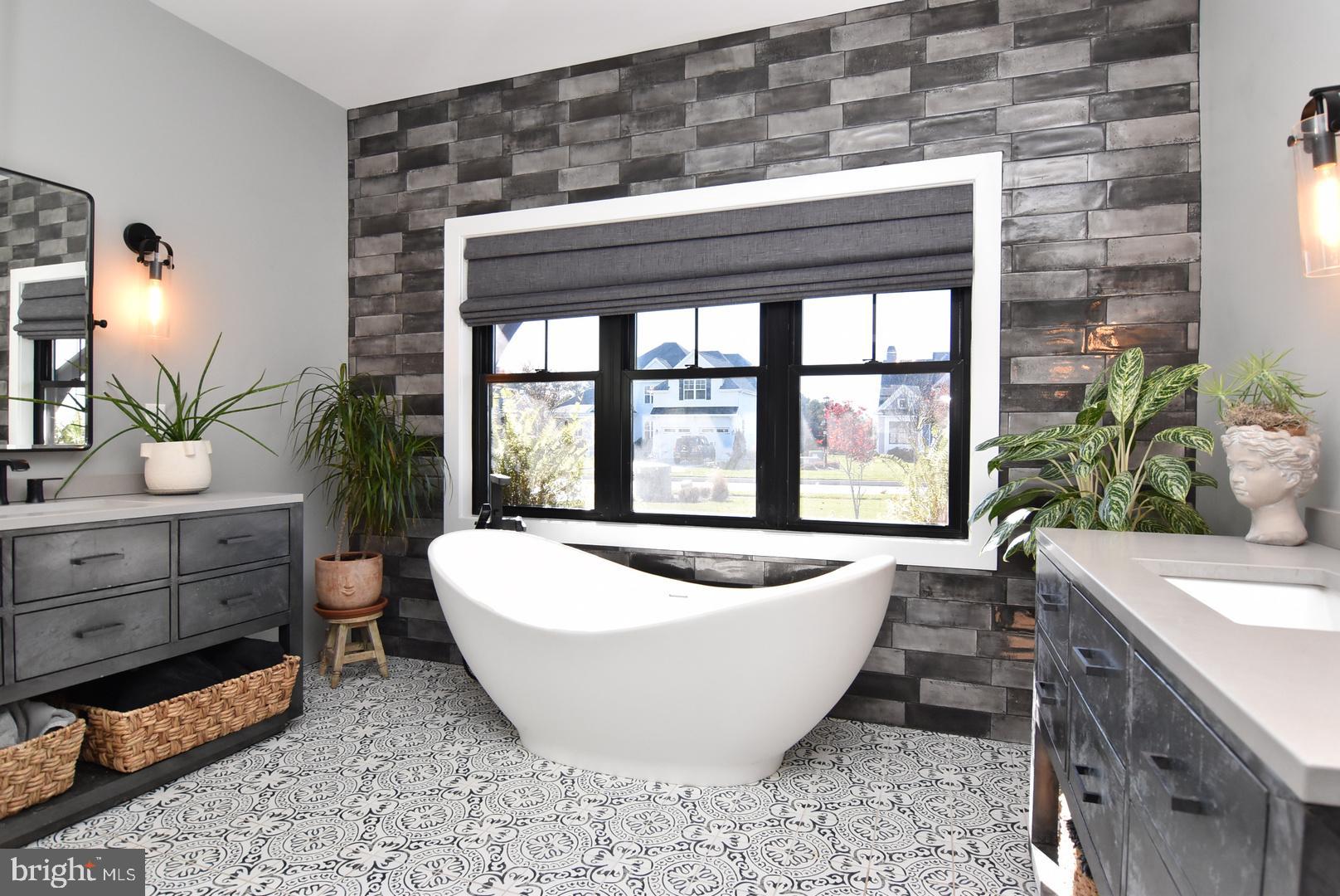 30921 Stallion Lane Lewes, DE 19958 - Photo 37 of 65 a living room with furniture and a potted plant