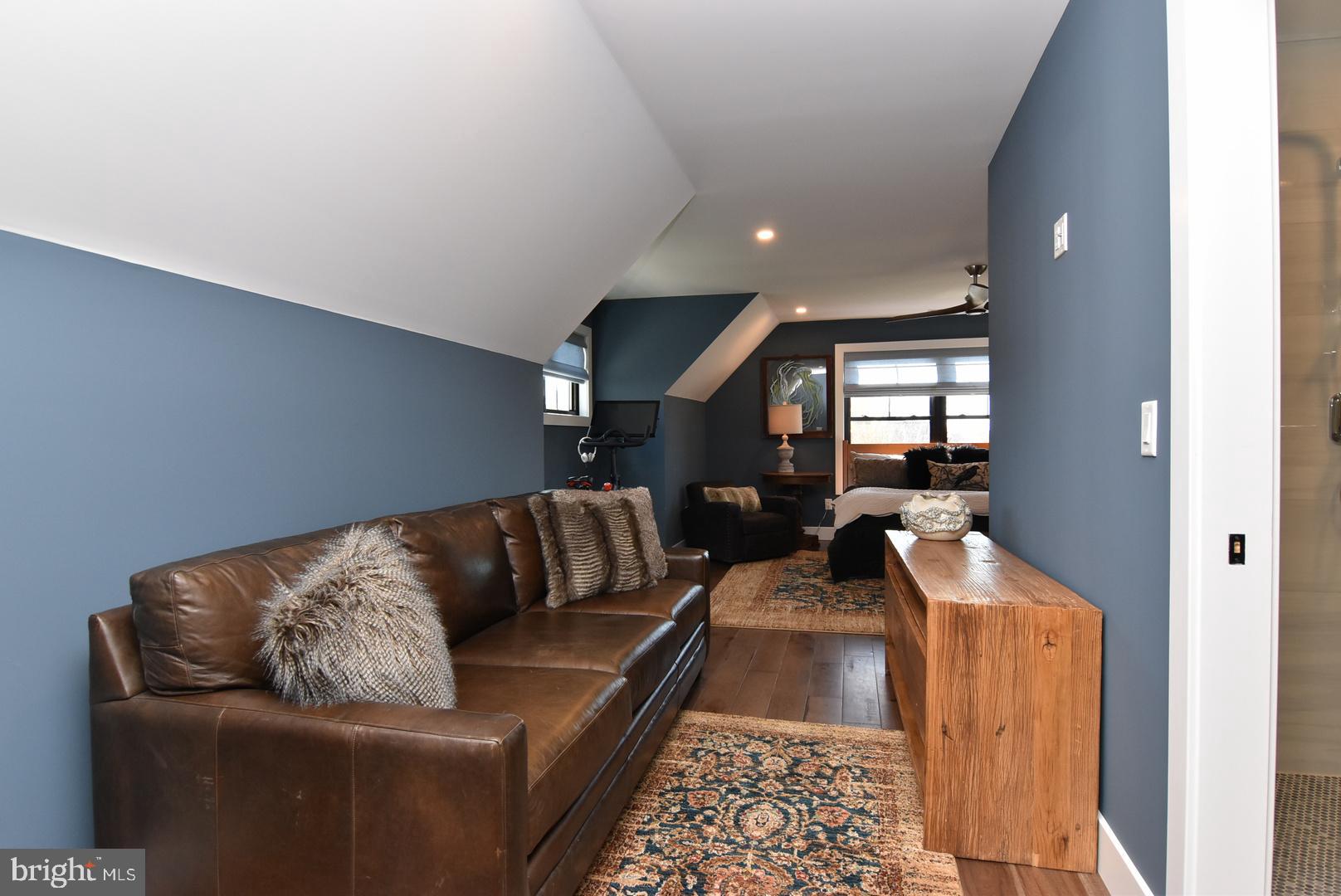30921 Stallion Lane Lewes, DE 19958 - Photo 43 of 65 a living room with furniture and a rug