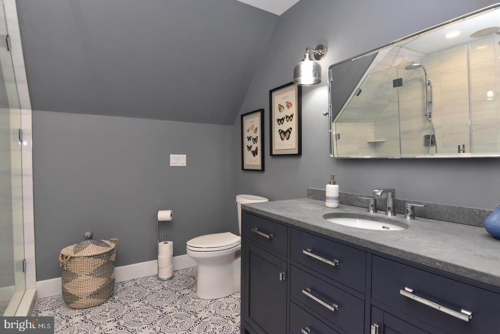 30921 Stallion Lane Lewes, DE 19958 - Photo 46 of 65 a bathroom with a toilet sink and mirror