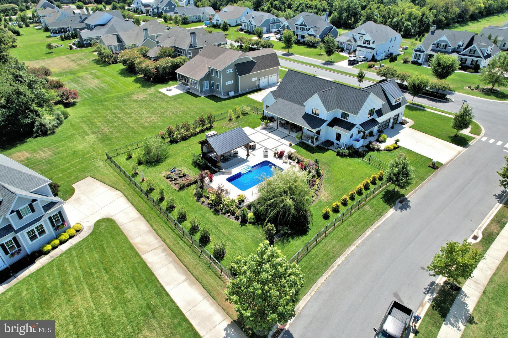30921 Stallion Lane Lewes, DE 19958 - Photo 57 of 65 an aerial view of a house with garden space lake ocean and mountain view in back
