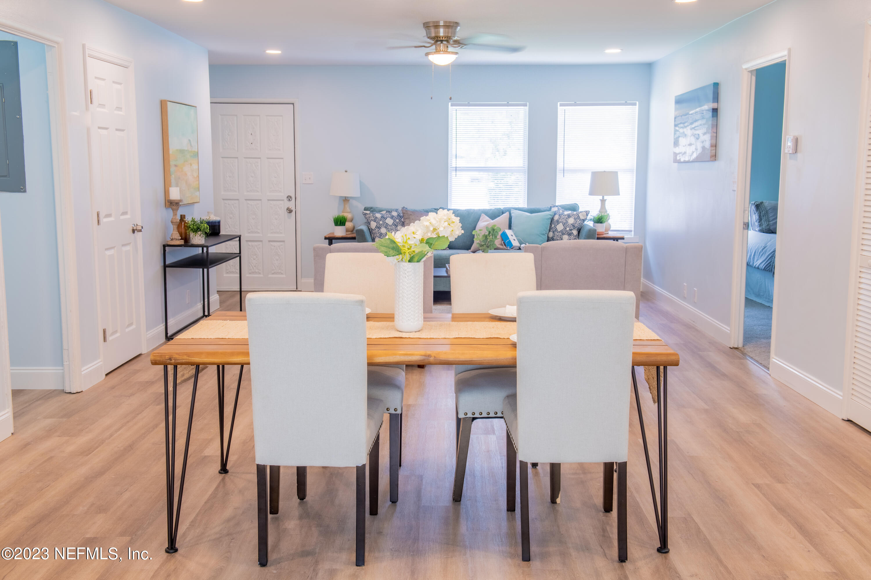 6958 Champlain Road Jacksonville, FL 32208 - Photo 11 of 34 a view of a dining room with furniture and wooden floor