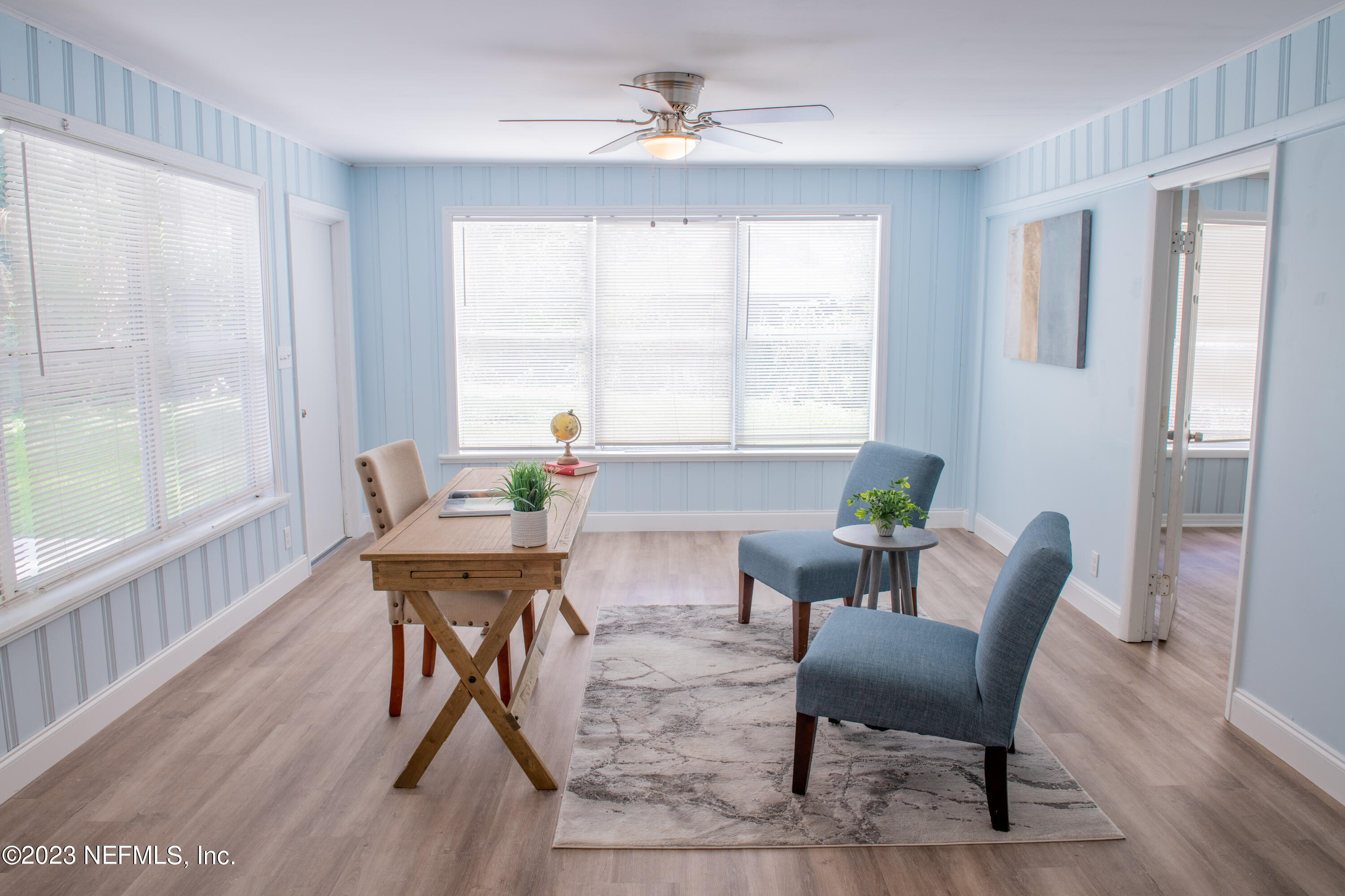 6958 Champlain Road Jacksonville, FL 32208 - Photo 13 of 34 a view of a dining room with furniture window and wooden floor
