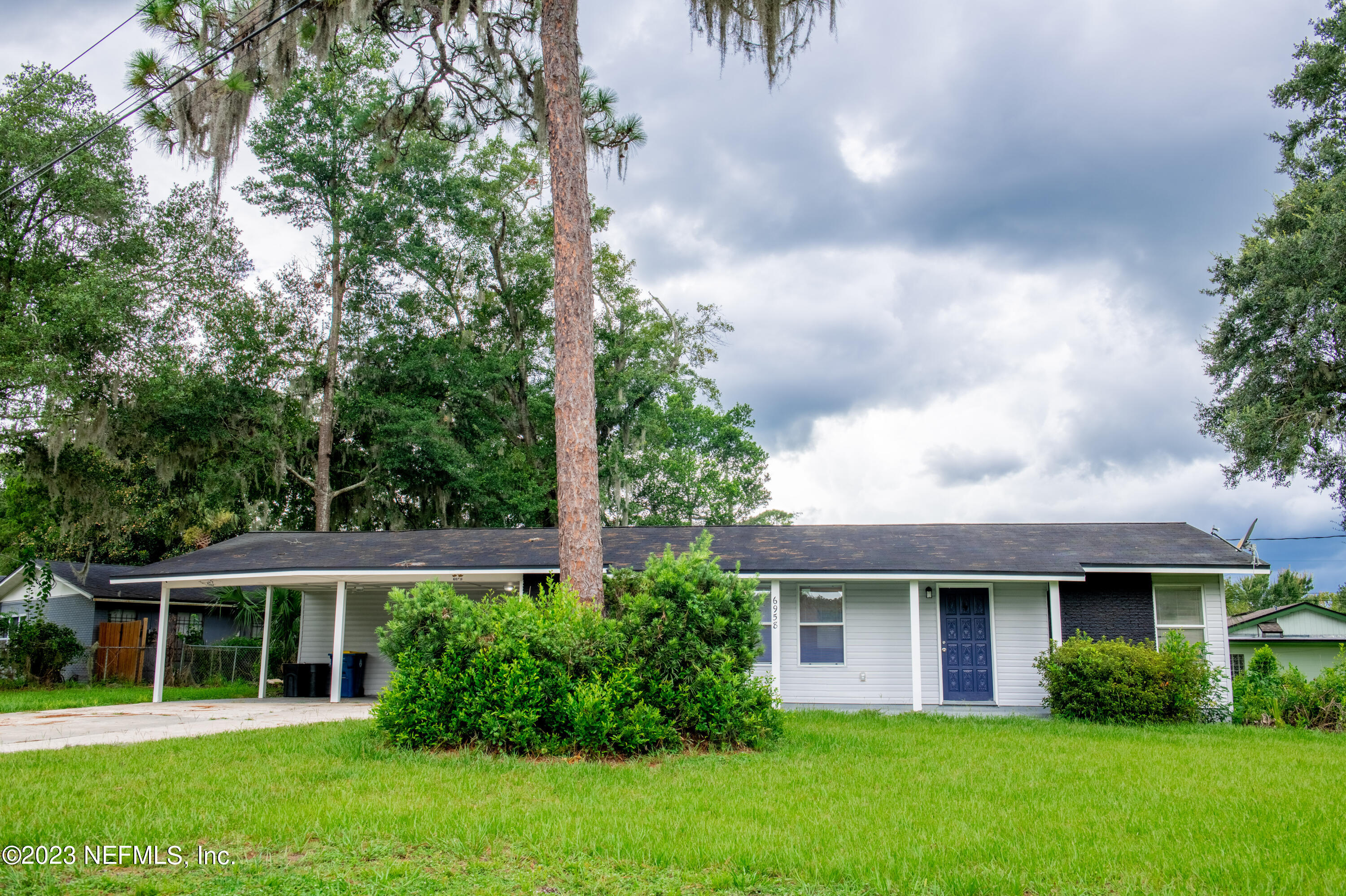 6958 Champlain Road Jacksonville, FL 32208 - Photo 27 of 34 a house view with a garden space