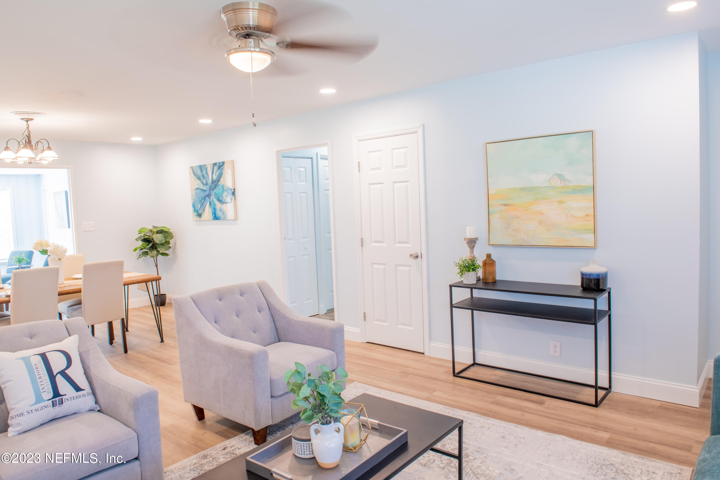 6958 Champlain Road Jacksonville, FL 32208 - Photo 8 of 34 a living room with furniture and a potted plant