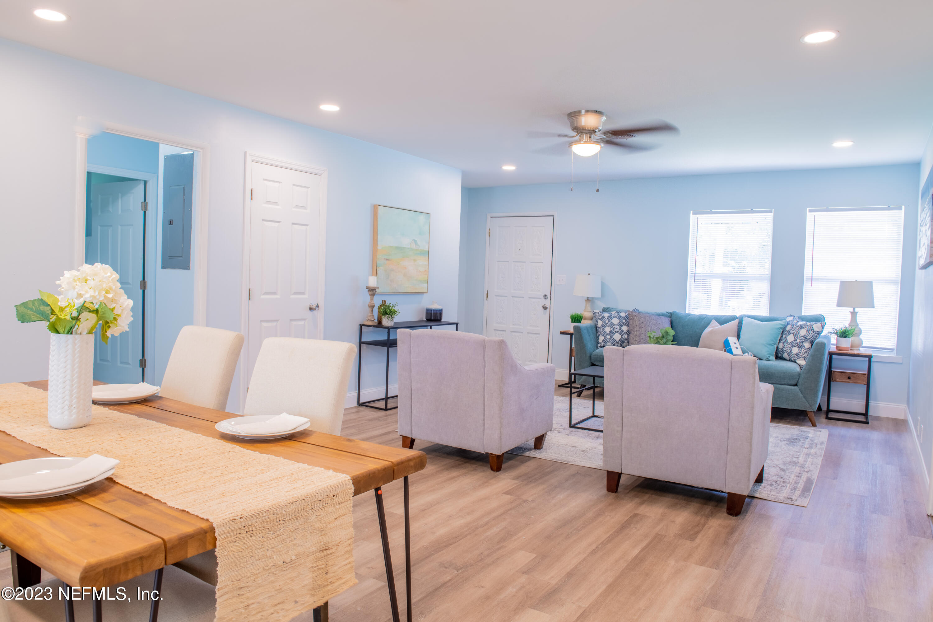 6958 Champlain Road Jacksonville, FL 32208 - Photo 9 of 34 a living room with furniture and wooden floor