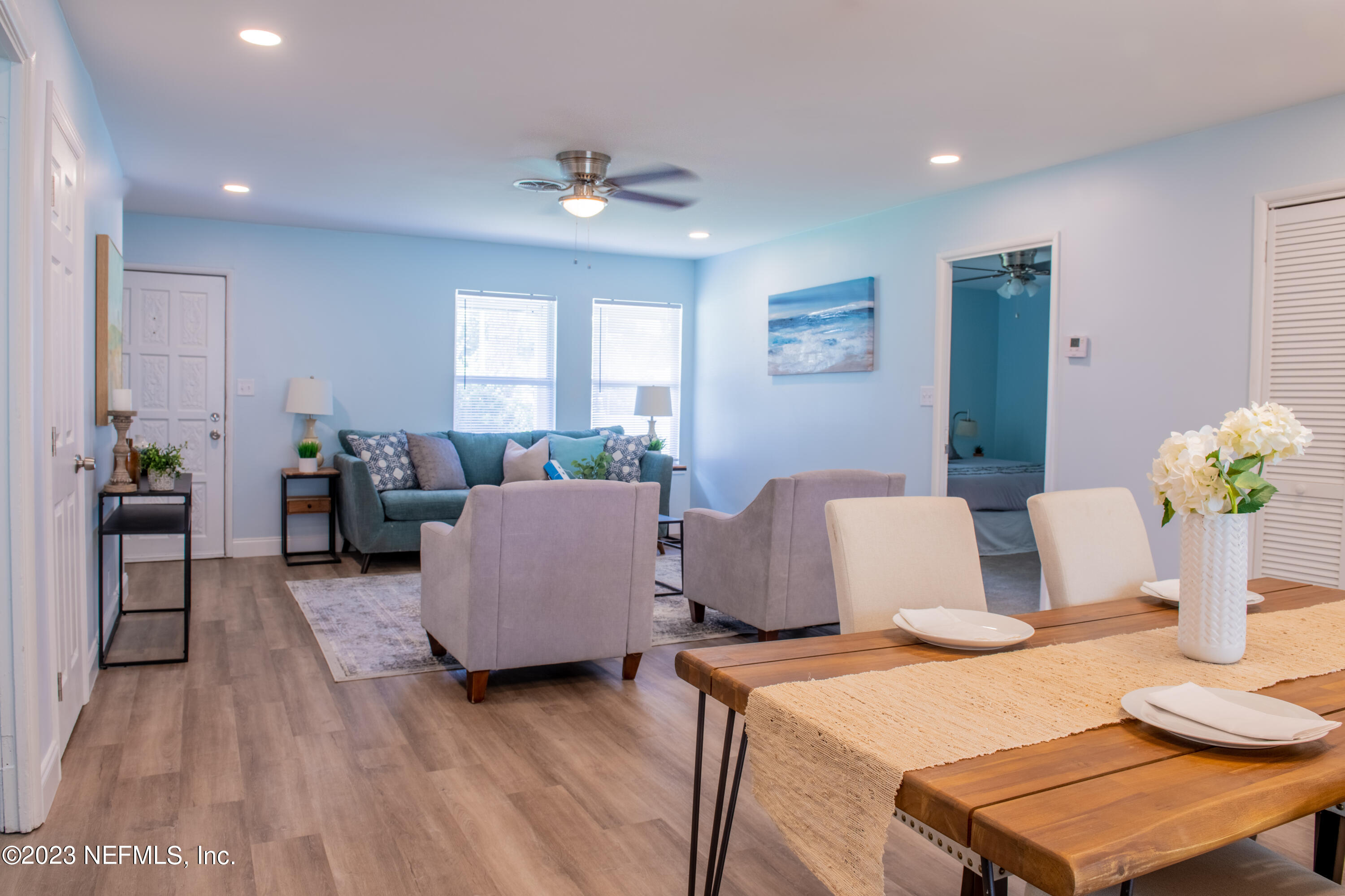 6958 Champlain Road Jacksonville, FL 32208 - Photo 10 of 34 a living room with furniture and wooden floor