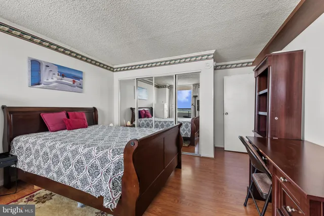 a bed room with a bed and a television