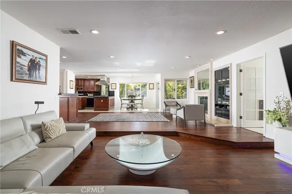 a bathroom with a toilet a sink and a window